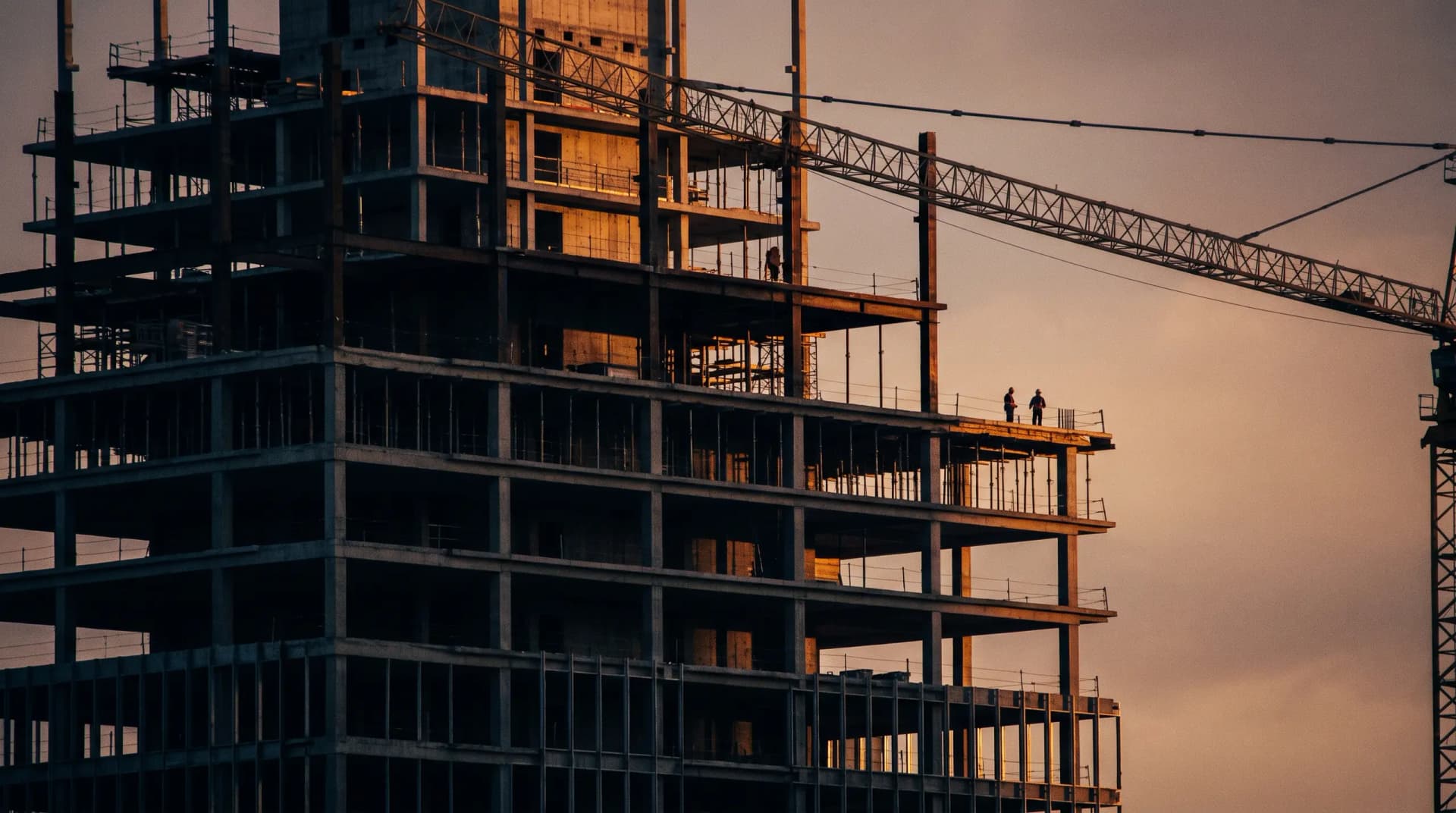 High-rise construction site at golden hour